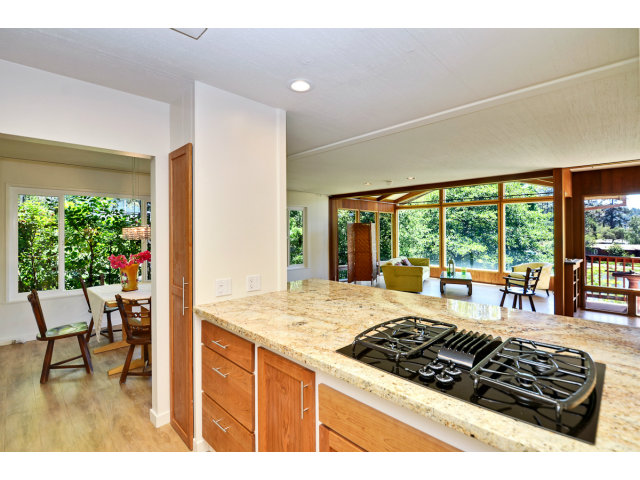 552 Bean Creek Road, Unit 88 Scotts Valley, CA 95066 - Photo 6 of 25 a kitchen with a stove a refrigerator a sink dining table and chair