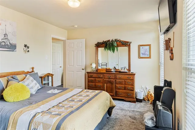 a bedroom with a bed and furniture