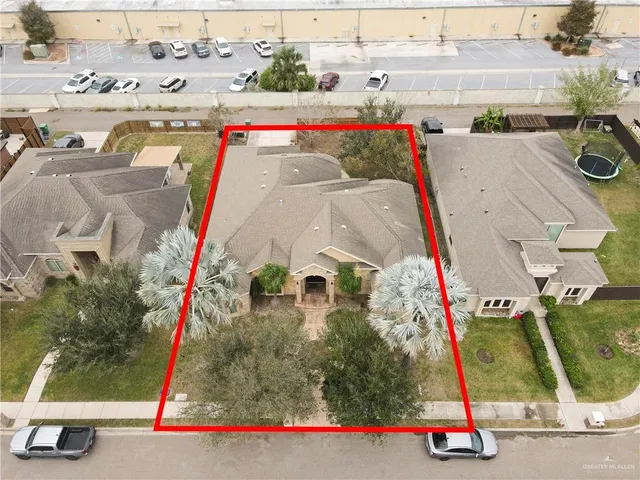 an aerial view of residential houses with outdoor space