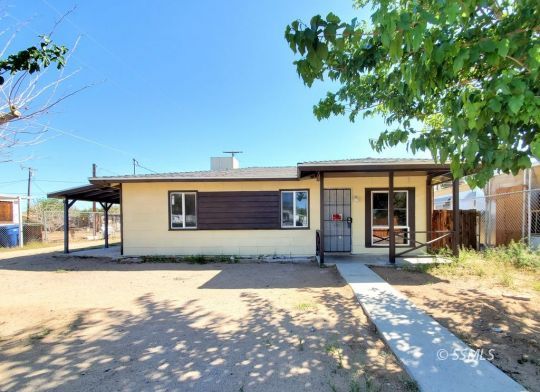 801 West Moyer Avenue Ridgecrest, CA 93555 - Photo 18 of 23 a front view of a house with a patio