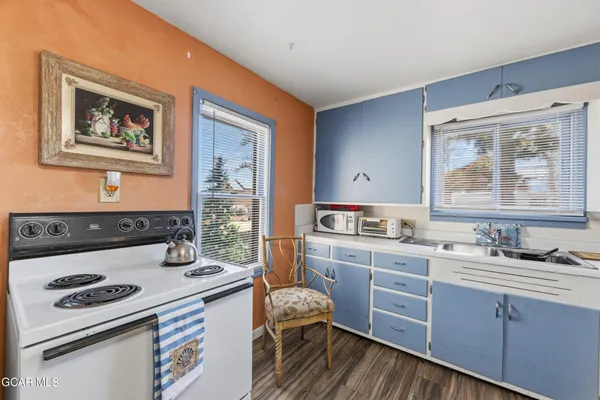 a kitchen with a stove and a sink