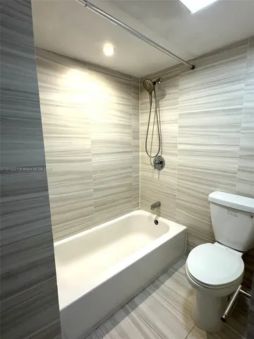 a bathroom with a toilet and a sink