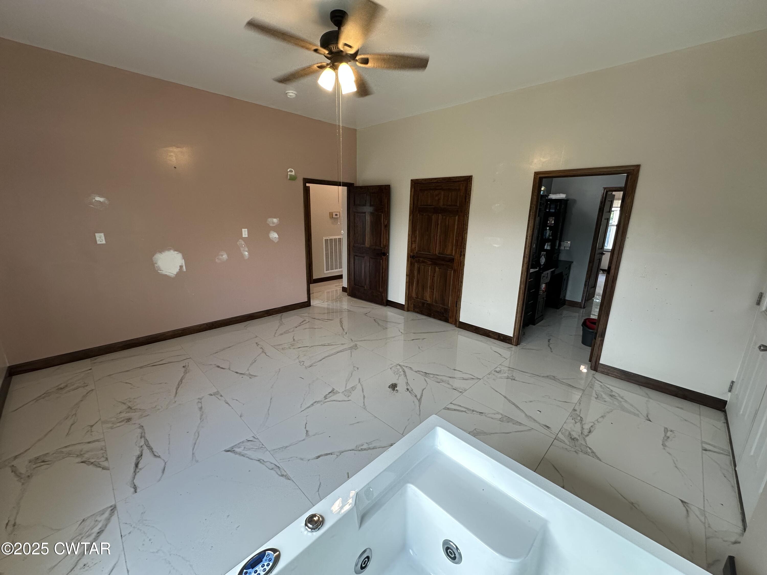 273 Fletcher Road Dyer, TN 38330 - Photo 14 of 46 a view of a livingroom with a ceiling fan and a bathroom