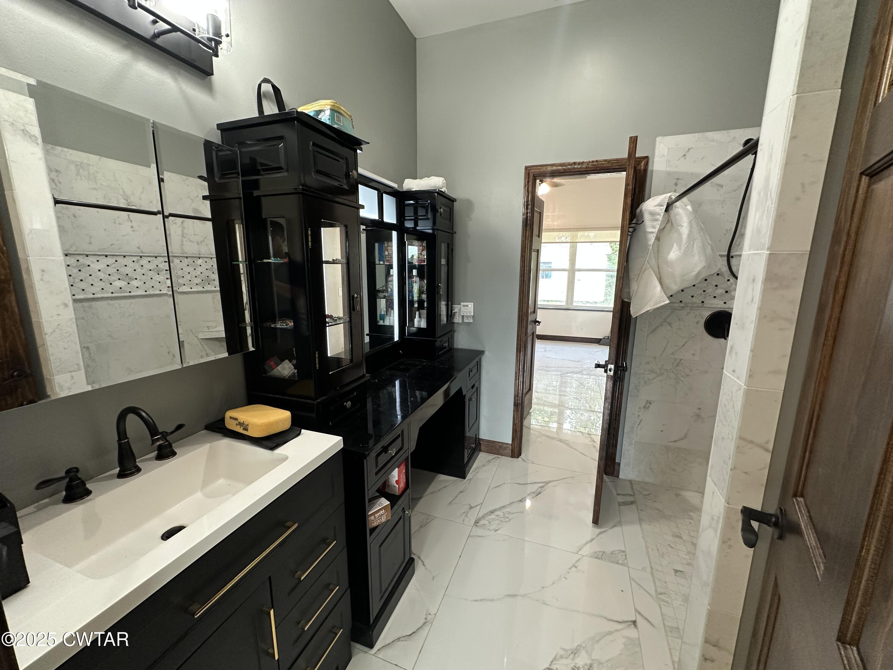 273 Fletcher Road Dyer, TN 38330 - Photo 17 of 46 a bathroom with a sink a mirror and shower