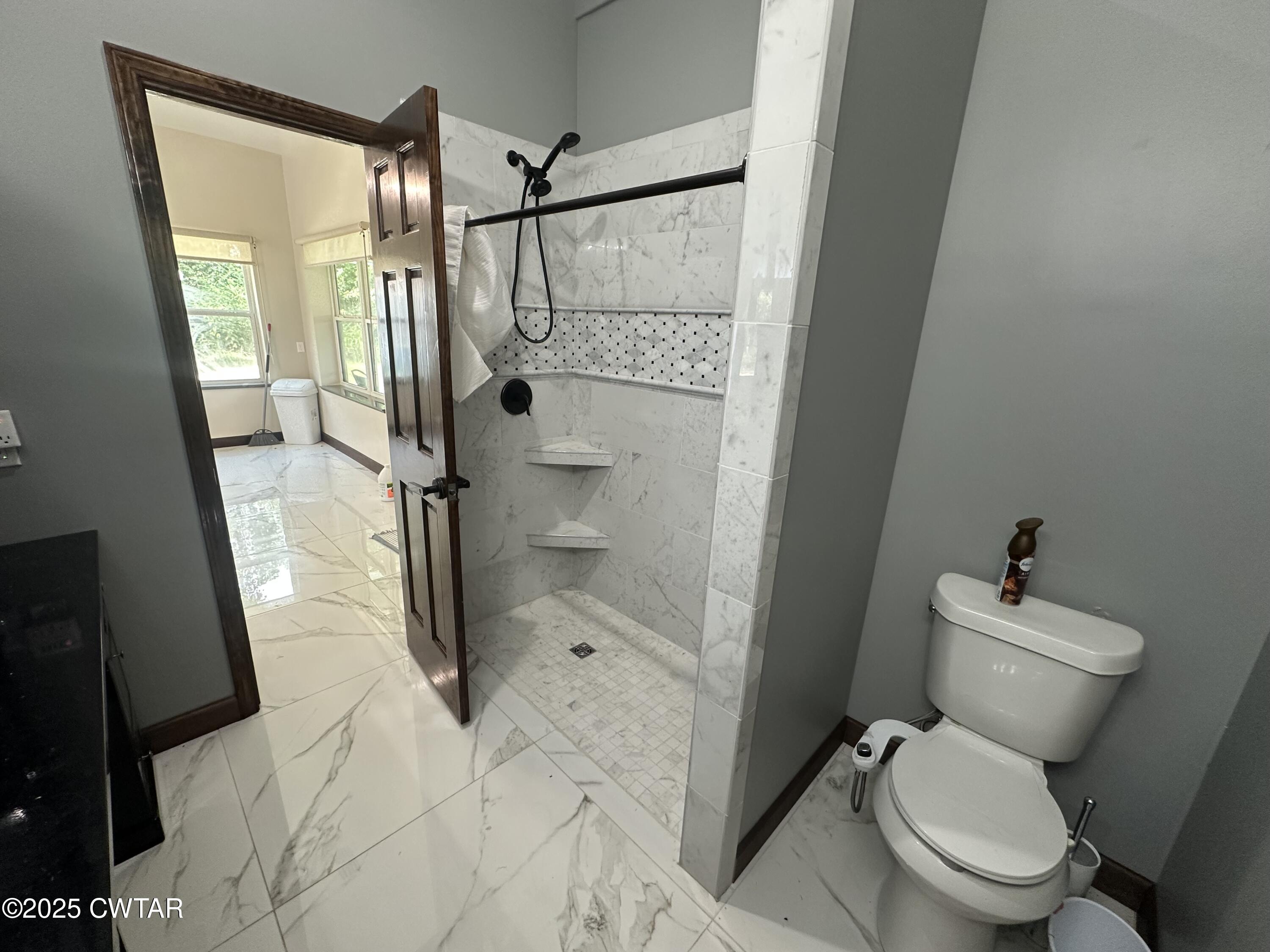 273 Fletcher Road Dyer, TN 38330 - Photo 18 of 46 a bathroom with a granite countertop toilet a sink and shower