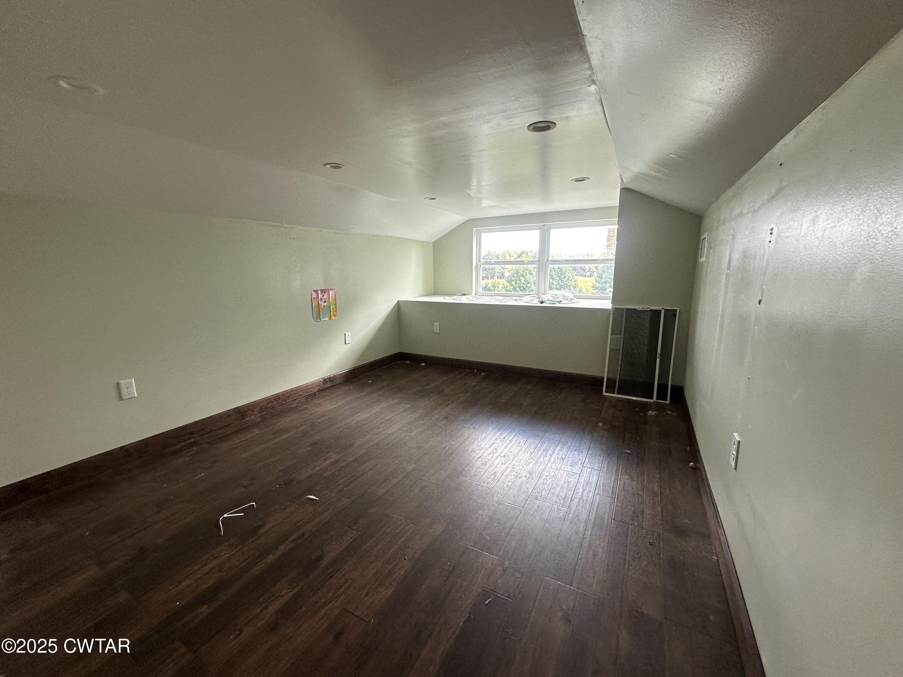 273 Fletcher Road Dyer, TN 38330 - Photo 25 of 46 an empty room with wooden floor and windows