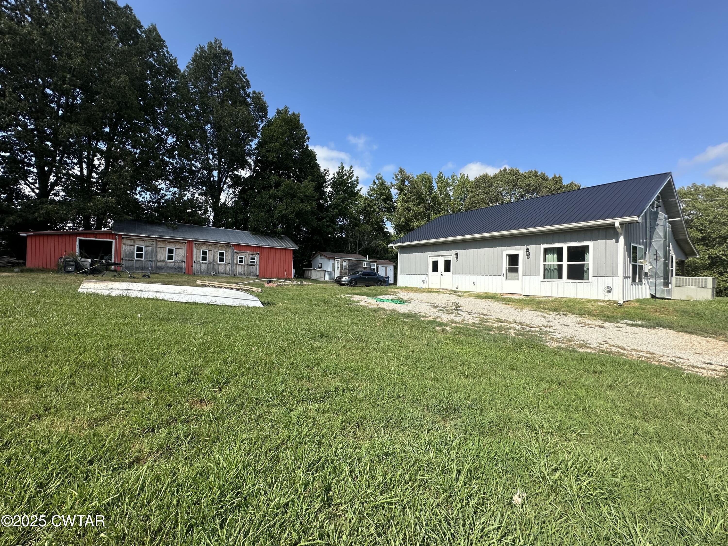 273 Fletcher Road Dyer, TN 38330 - Photo 29 of 46 a view of house with a garden and deck