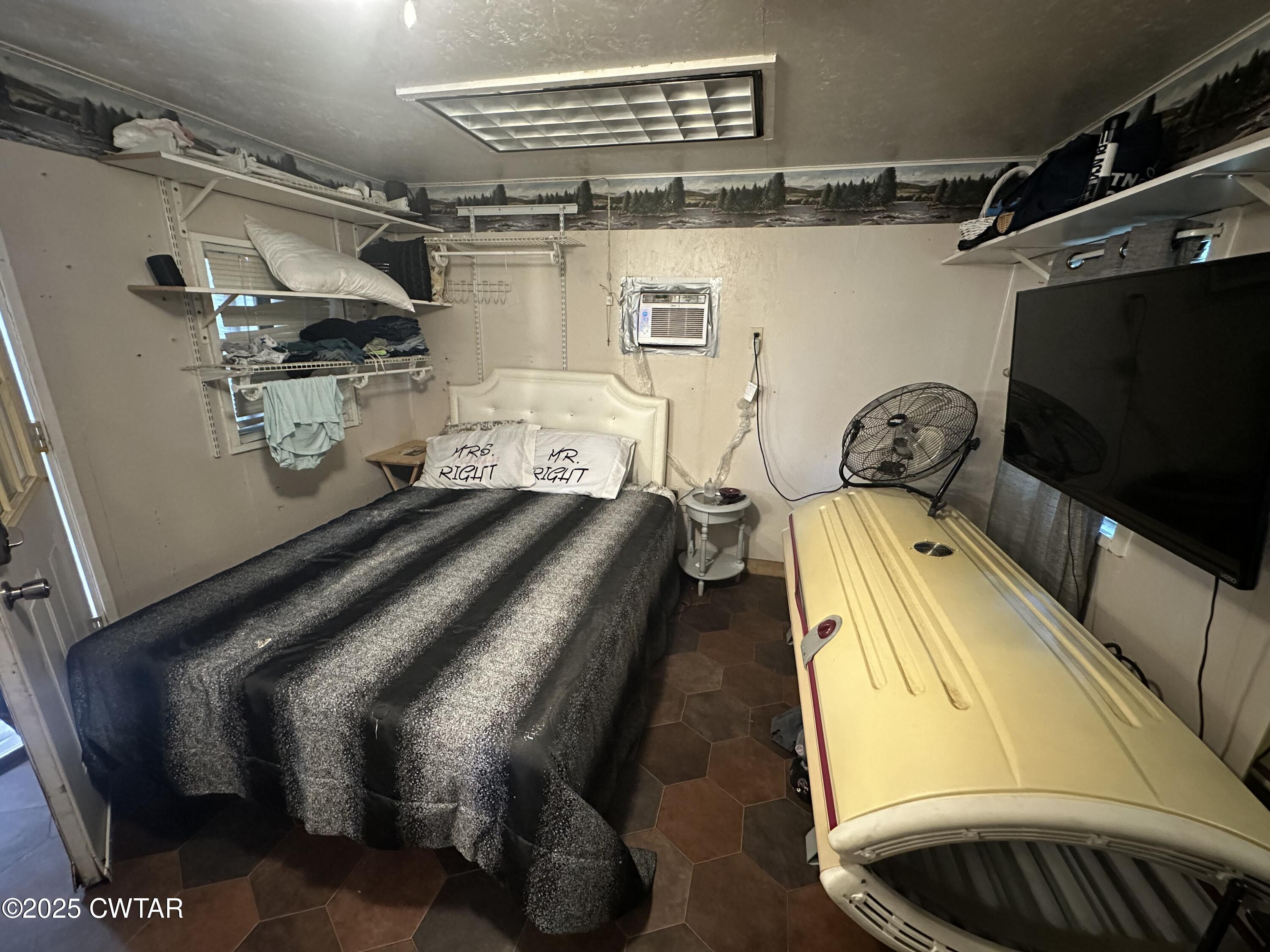 273 Fletcher Road Dyer, TN 38330 - Photo 33 of 46 a bed room with a bed and a television