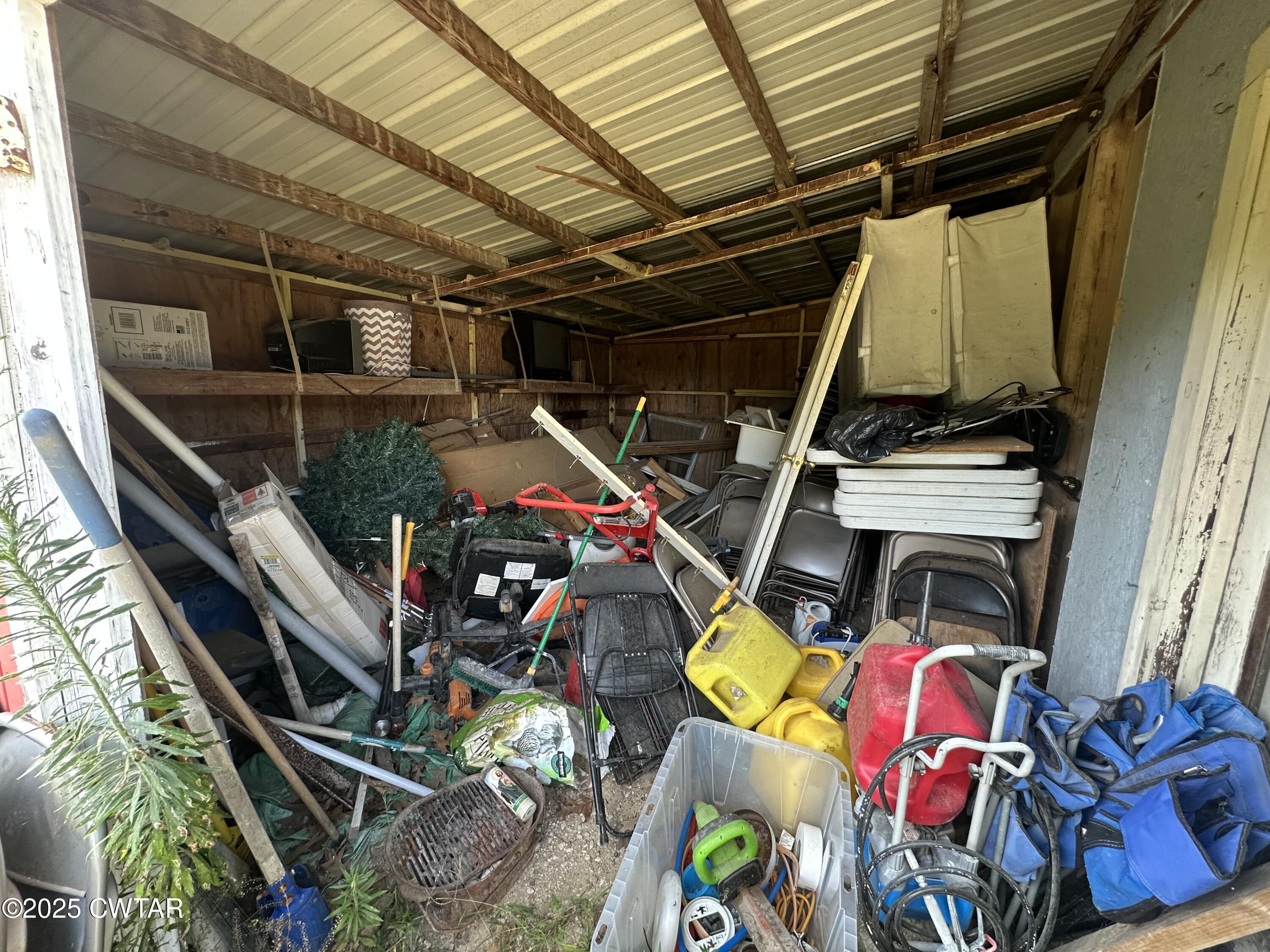 273 Fletcher Road Dyer, TN 38330 - Photo 40 of 46 a view of walk in closet with clothes