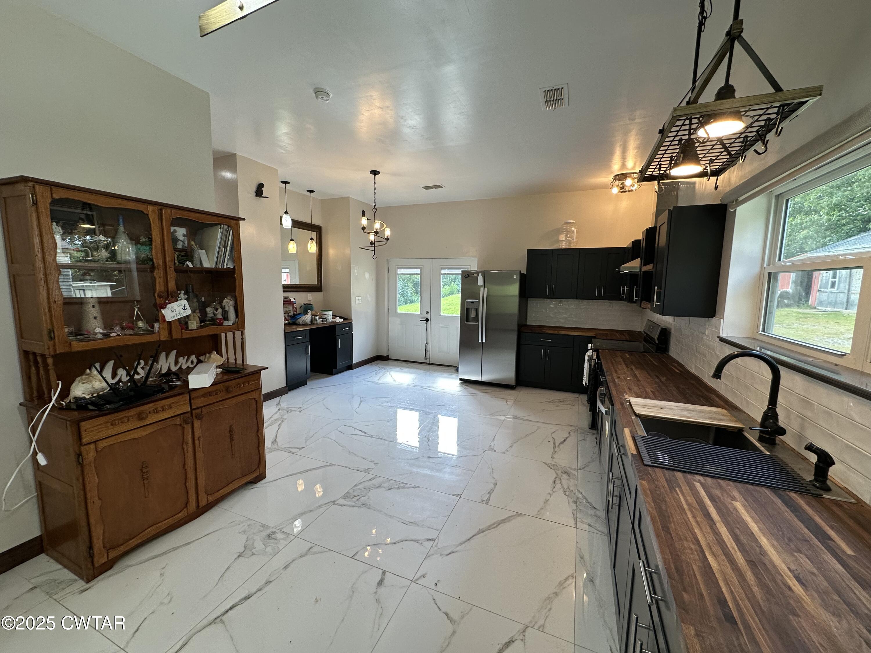 273 Fletcher Road Dyer, TN 38330 - Photo 5 of 46 a large living room with stainless steel appliances granite countertop lots of counter top space
