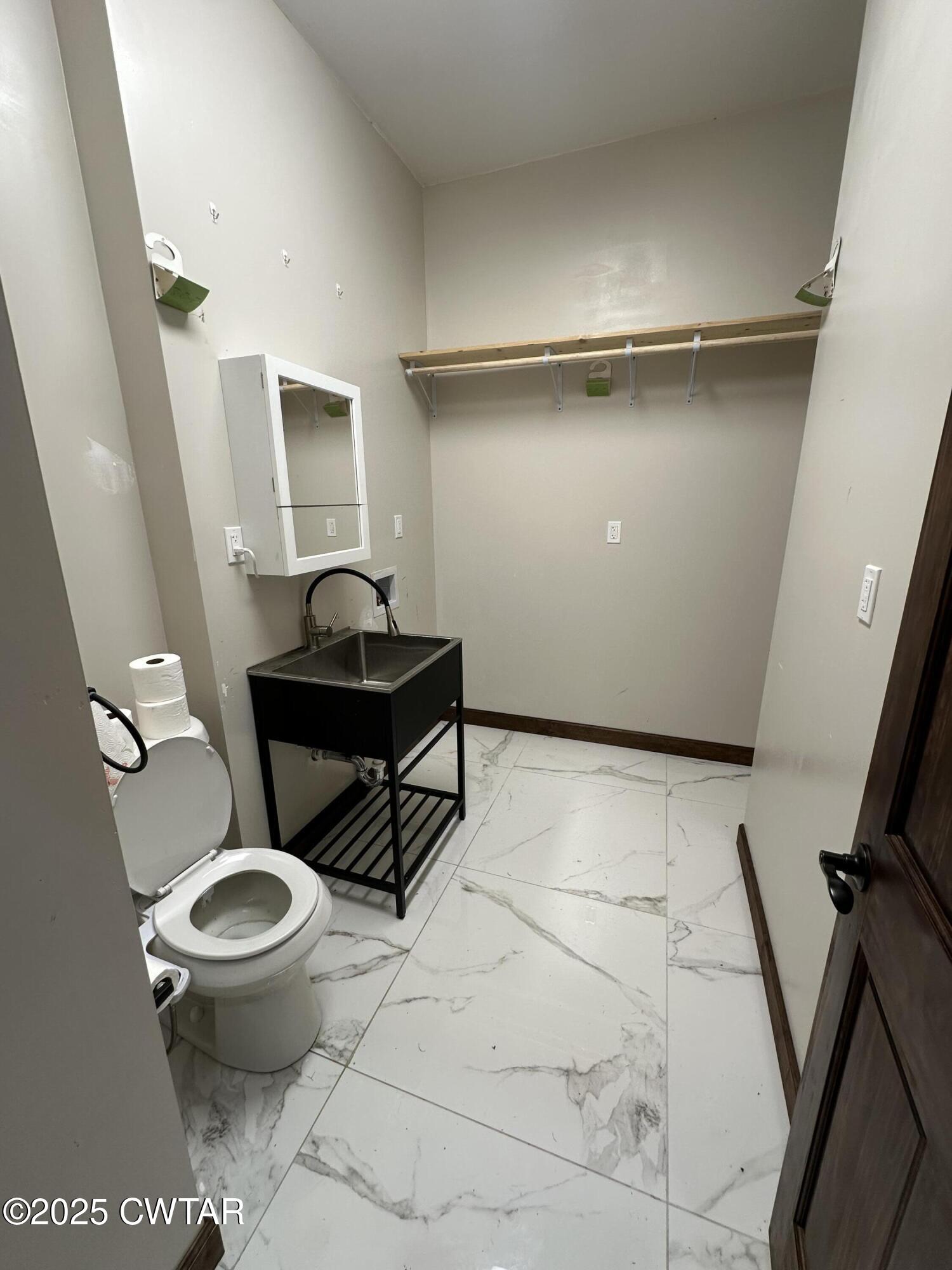 273 Fletcher Road Dyer, TN 38330 - Photo 8 of 46 a bathroom with a toilet and a sink