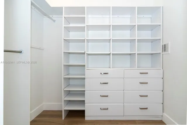 a view of an empty walk in closet