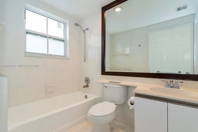 a bathroom with a sink a toilet and a bathtub