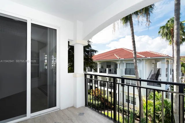 a view of a small yard from a balcony