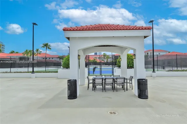 a man sitting on a bench in front of a building
