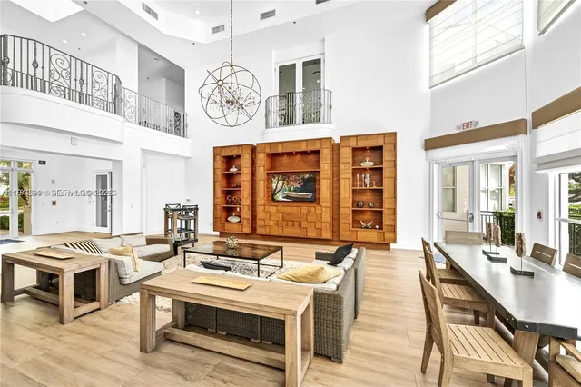 a living room with fireplace furniture and a window