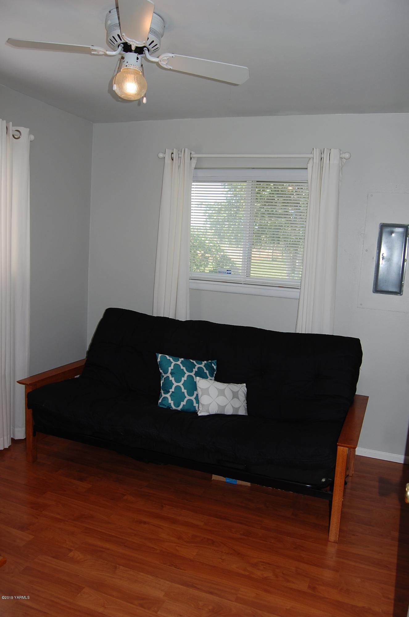 2710 Nelson Road Yakima, WA 98903 - Photo 15 of 30 a living room with furniture and a fireplace