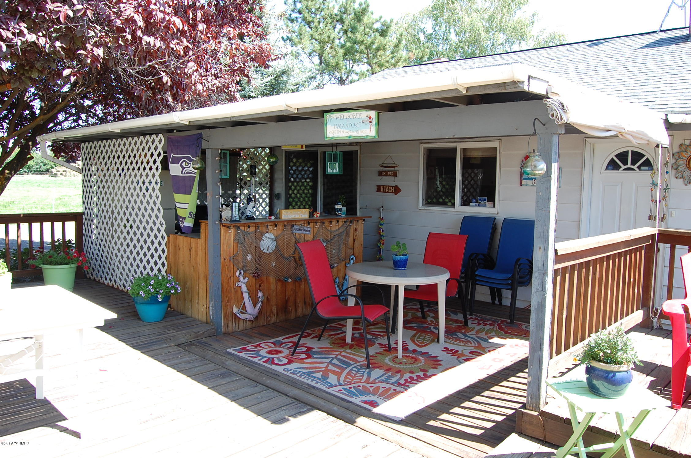 2710 Nelson Road Yakima, WA 98903 - Photo 17 of 30 a view of a patio with table and chairs and wooden fence