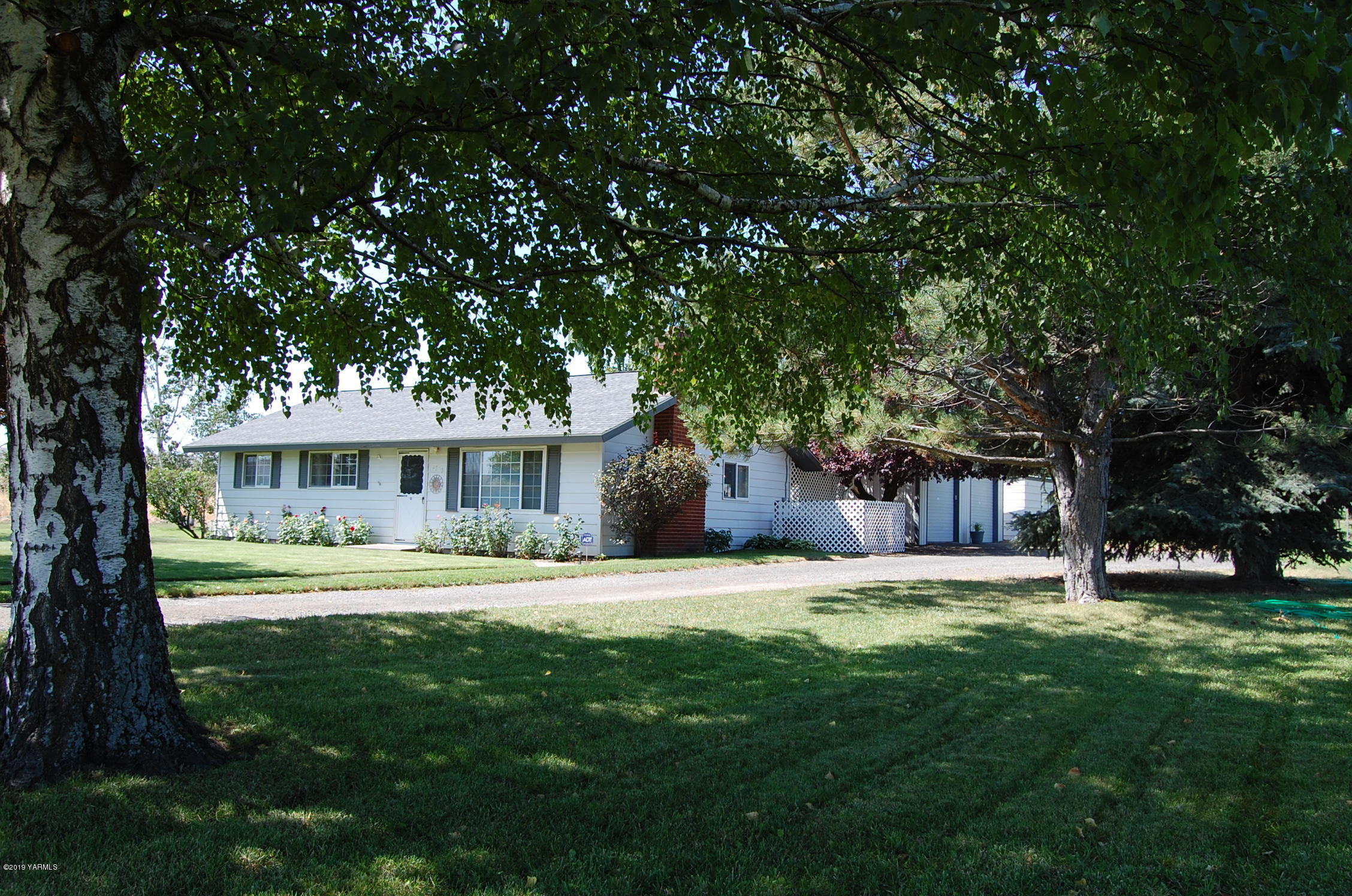 2710 Nelson Road Yakima, WA 98903 - Photo 30 of 30 a front view of a house with a yard and trees