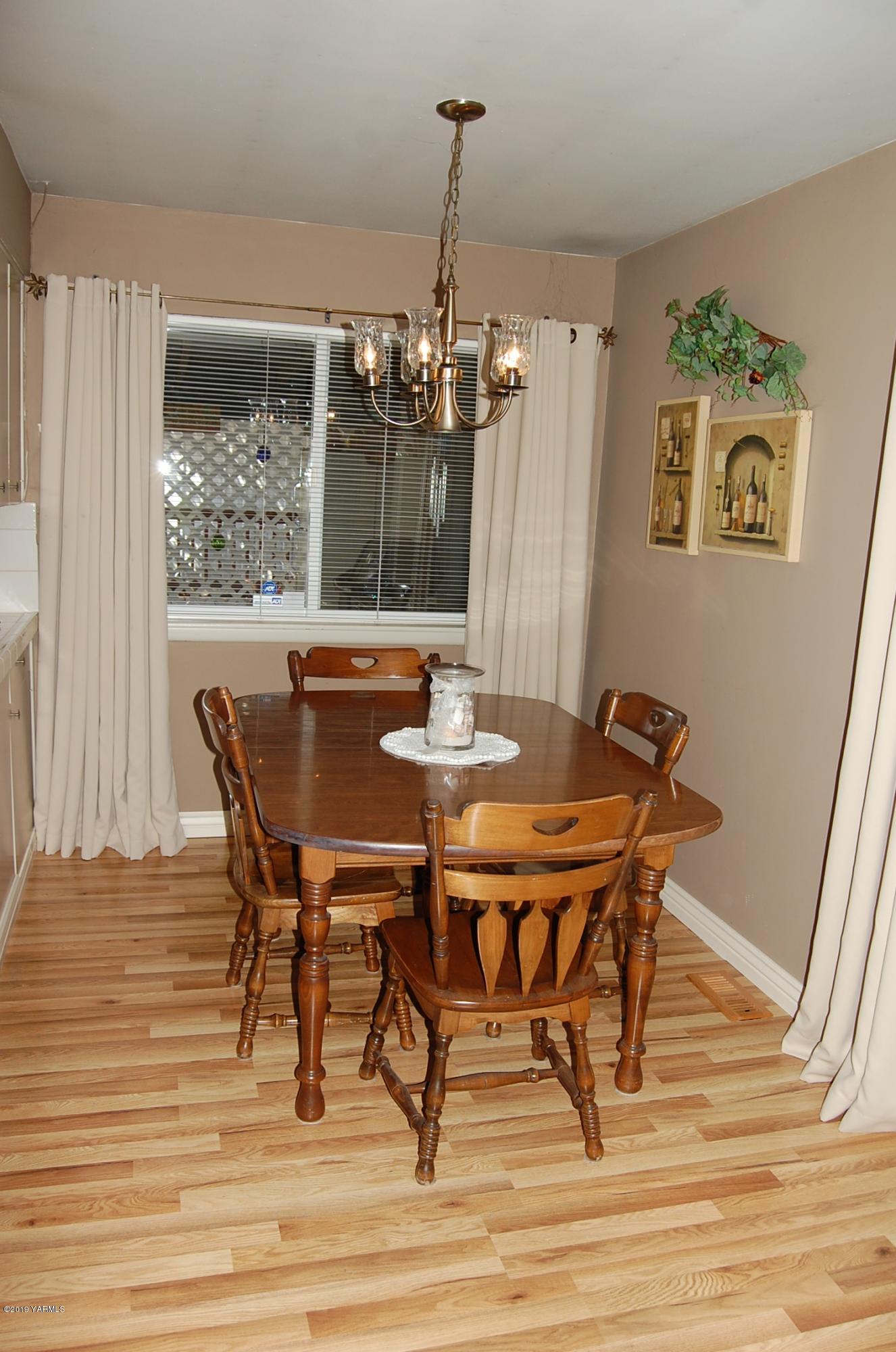 2710 Nelson Road Yakima, WA 98903 - Photo 8 of 30 a view of a dining room with furniture window and wooden floor