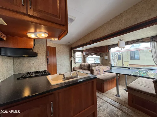 a view of a patio with table and chairs