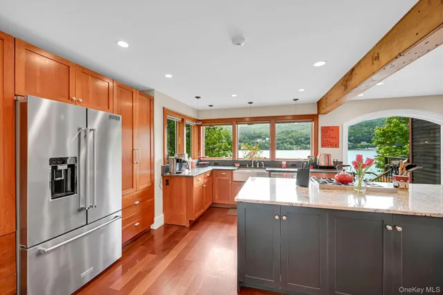 a kitchen with large counter top space and stainless steel appliances