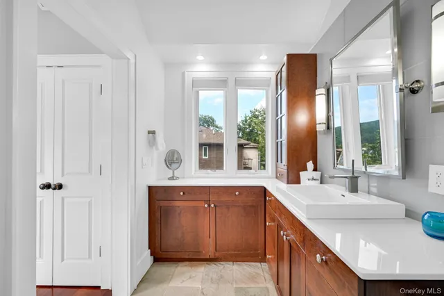 a spacious bedroom with a bed and a large window