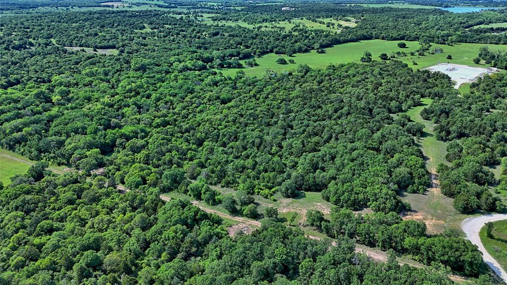 500 Starkey Ranch Road St. Jo, TX 76265 - Photo 14 of 16 an aerial view of a house with a yard