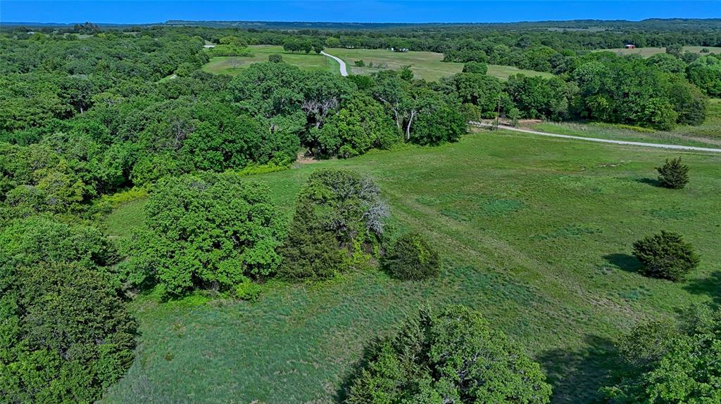 500 Starkey Ranch Road St. Jo, TX 76265 - Photo 6 of 16 a view of a lush green field