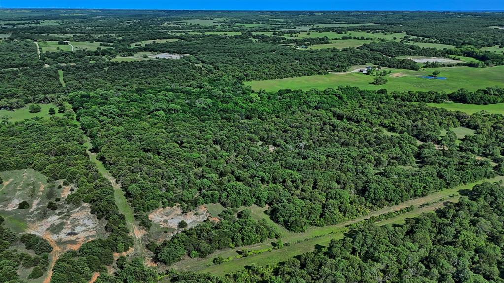 500 Starkey Ranch Road St. Jo, TX 76265 - Photo 7 of 16 an aerial view of residential houses with outdoor space and trees