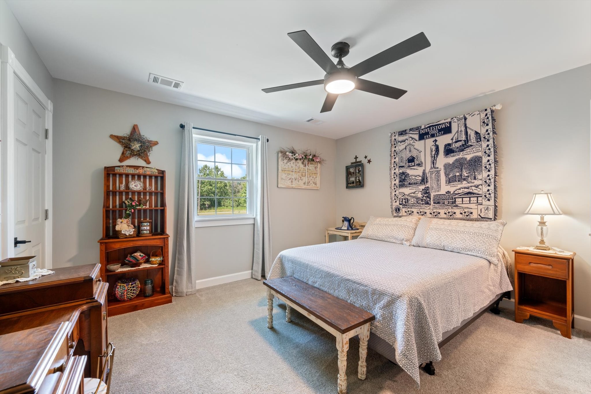 6395 Huffman Road Goodlettsville, TN 37072 - Photo 19 of 38 a bedroom with a bed a dresser and a window
