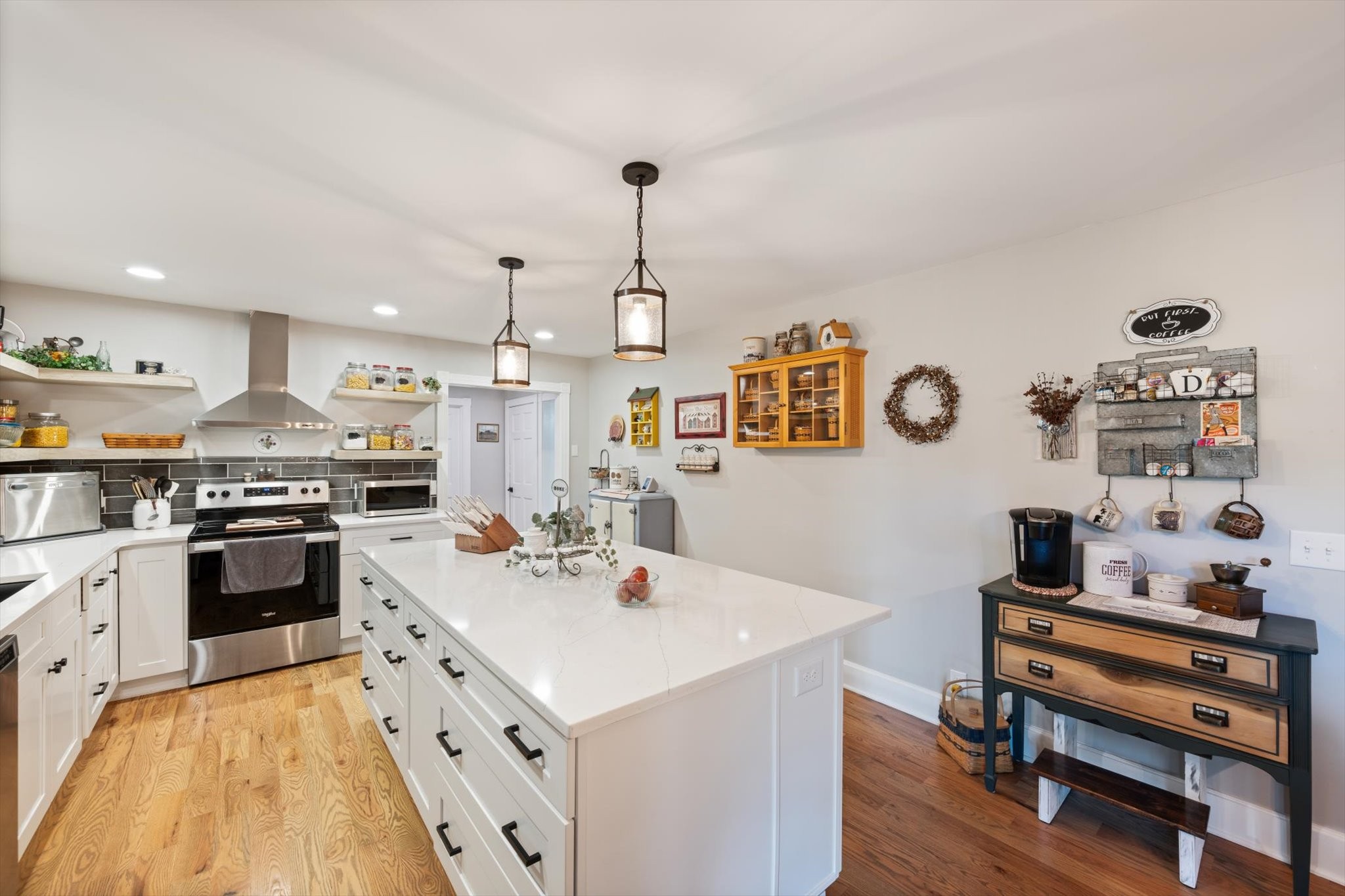 6395 Huffman Road Goodlettsville, TN 37072 - Photo 3 of 38 a kitchen with a sink stove and cabinets