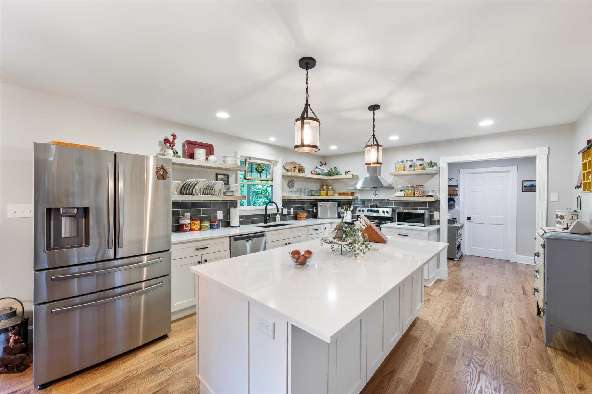 6395 Huffman Road Goodlettsville, TN 37072 - Photo 6 of 38 a kitchen with a sink stainless steel appliances and wooden floor