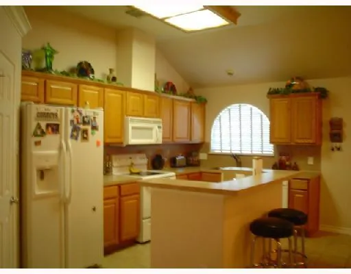 a bathroom with a sink a mirror and a shower