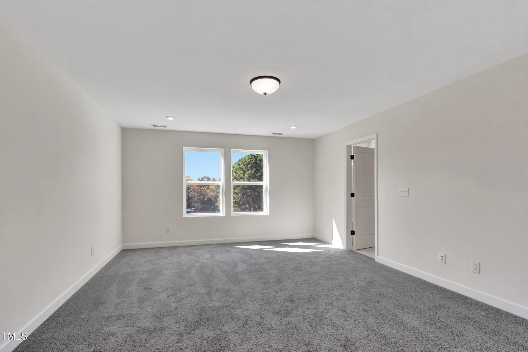 4413 Gehrig Lane, Unit 19 Raleigh, NC 27616 - Photo 23 of 38 Primary Bedroom