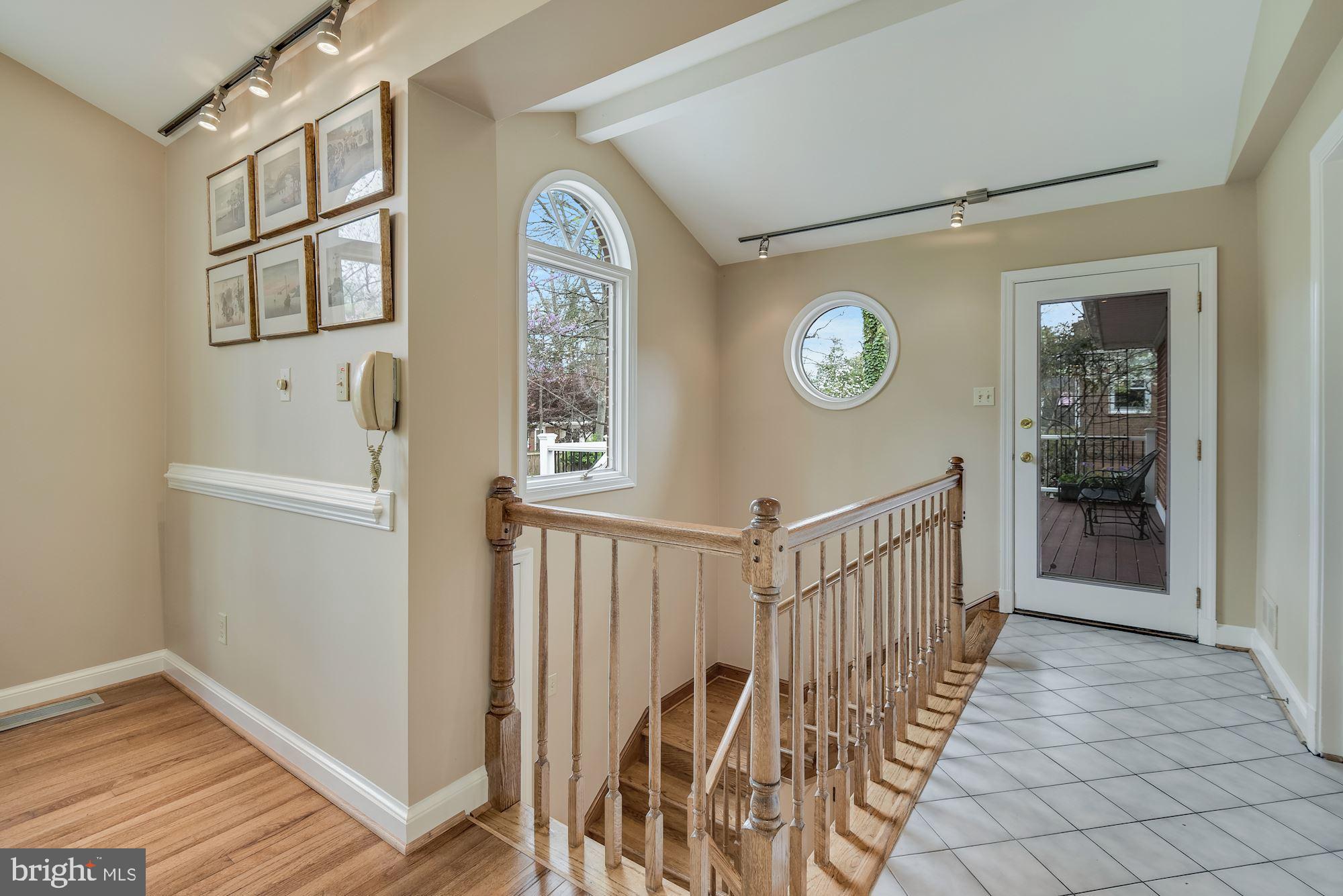 5616 Bent Branch Road Bethesda, MD 20816 - Photo 35 of 63 Stairs to lower level, door to deck