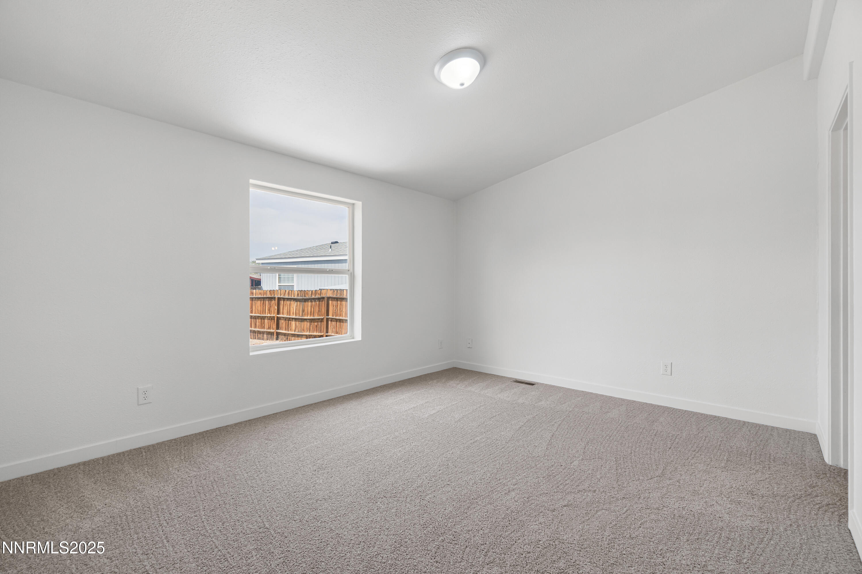 863 Jennys Lane Fernley, NV 89408 - Photo 16 of 24 an empty room with a window