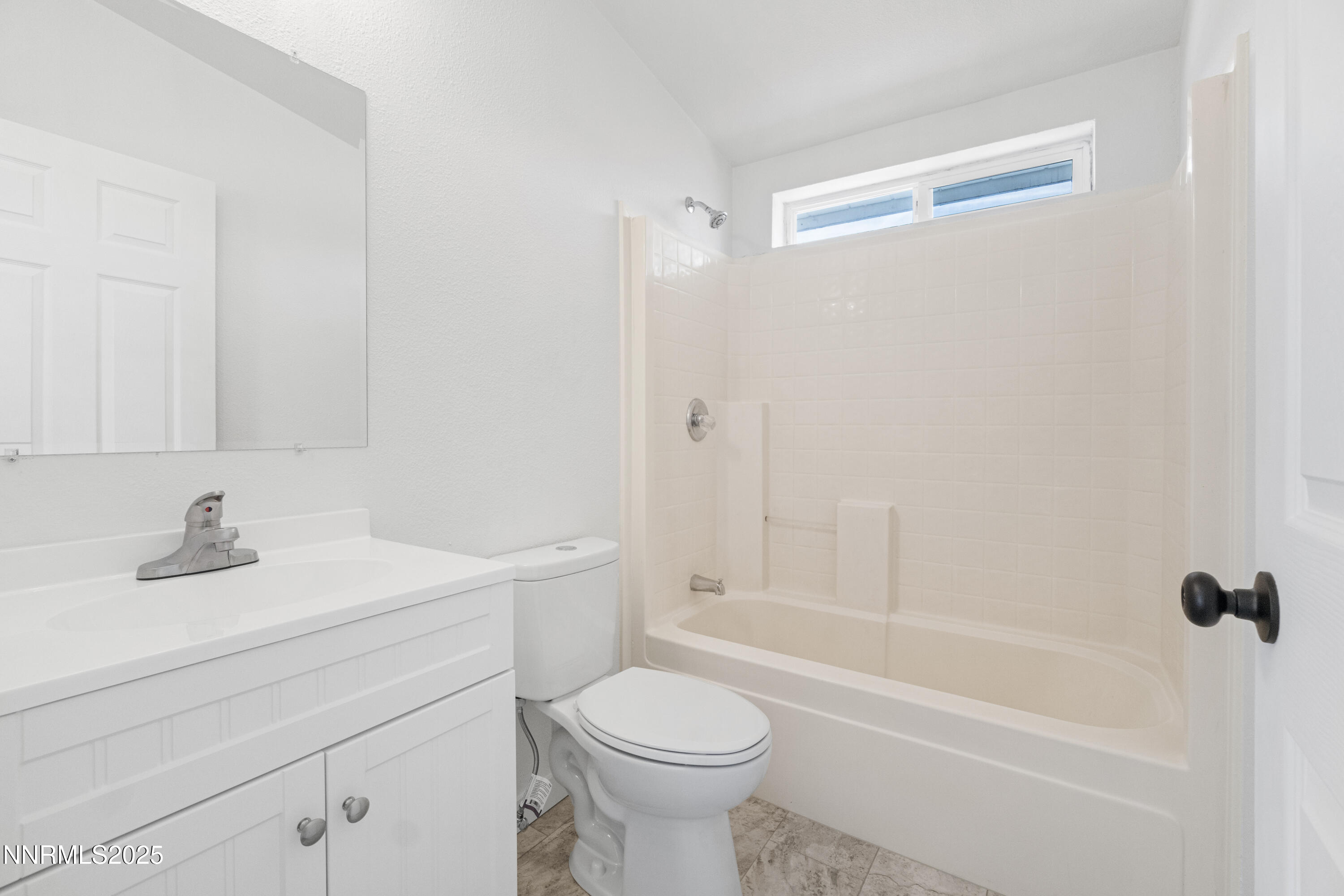 863 Jennys Lane Fernley, NV 89408 - Photo 17 of 24 a bathroom with a sink a toilet and a bathtub