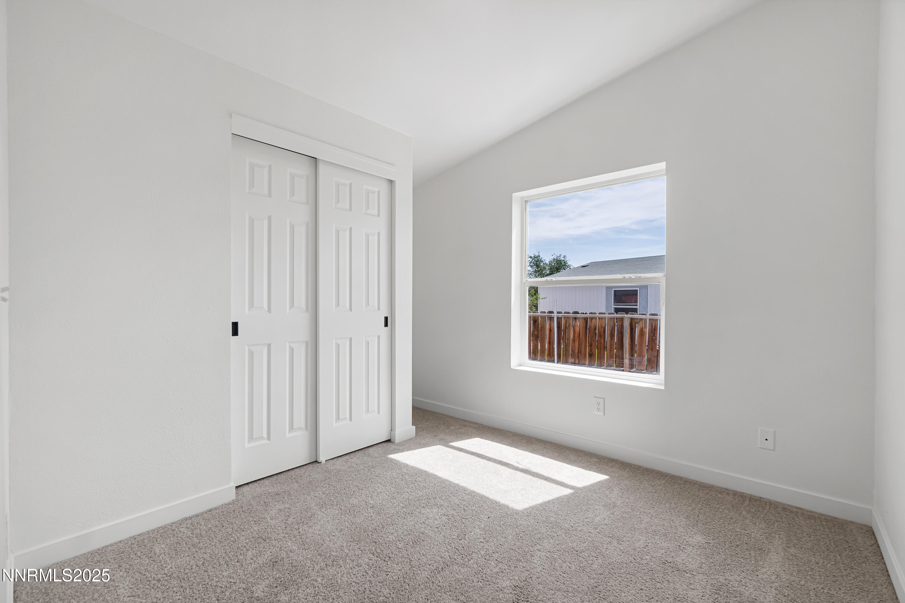 863 Jennys Lane Fernley, NV 89408 - Photo 18 of 24 a view of an empty room with a window