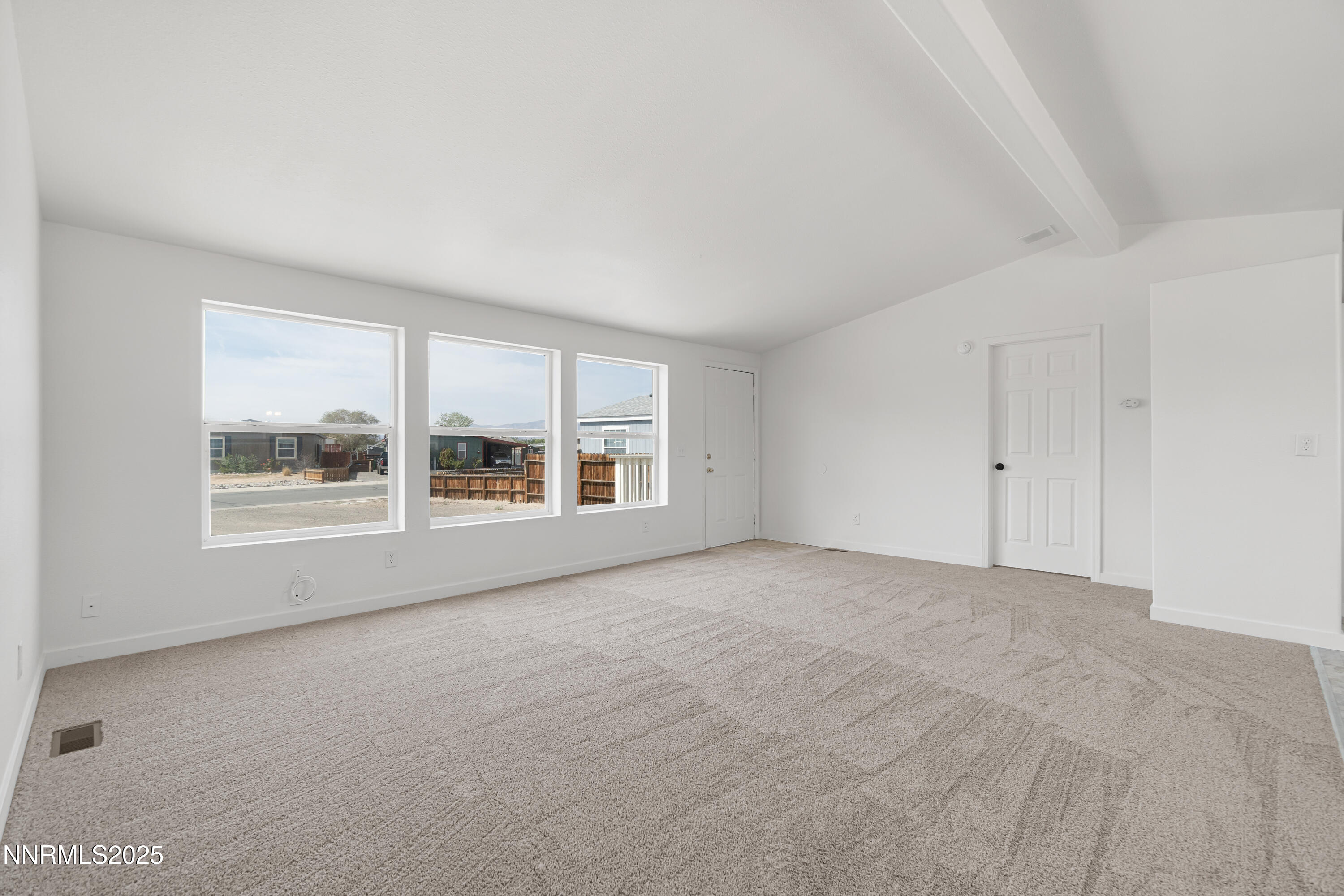 863 Jennys Lane Fernley, NV 89408 - Photo 7 of 24 a view of an empty room with a window