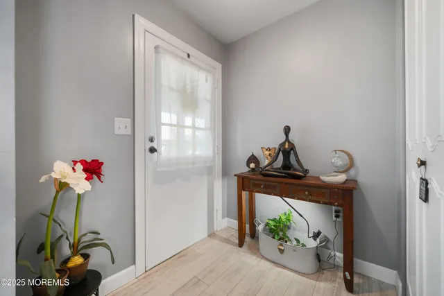 a living room with furniture and flowers