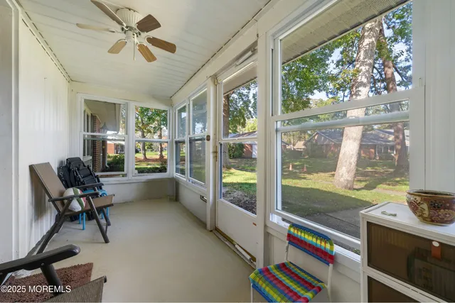 a work room with wooden floor and furniture