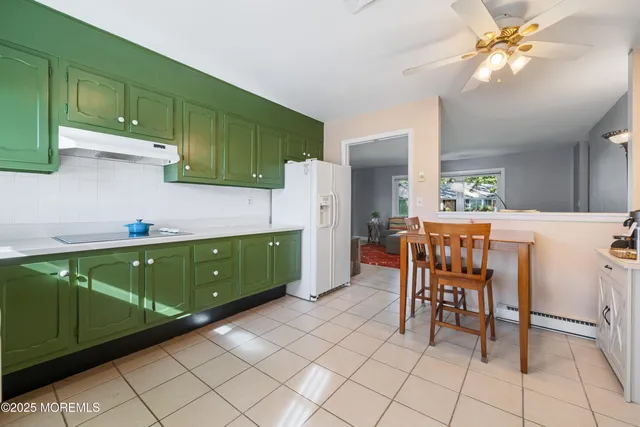 a kitchen with a cabinets a sink and wooden cabinets
