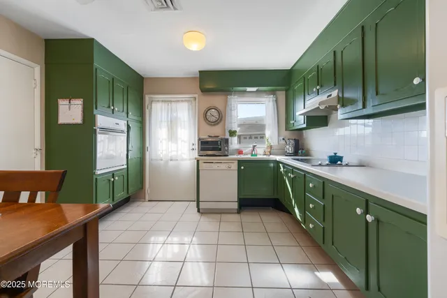 a kitchen with a cabinets a sink and a view of kitchen