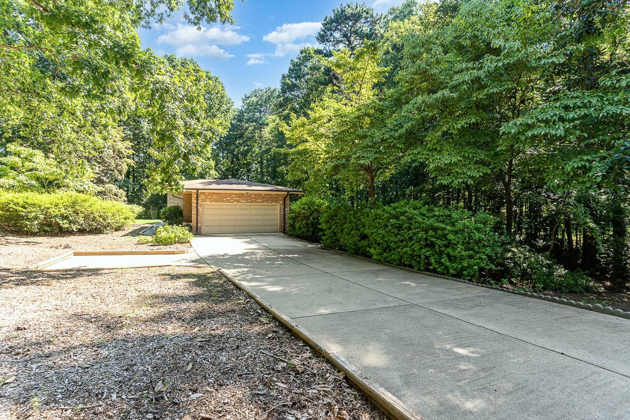 8600 Lawn Court Raleigh, NC 27613 - Photo 4 of 31 Plenty of room for parking in this driveway and cul-de-sac. Driveway