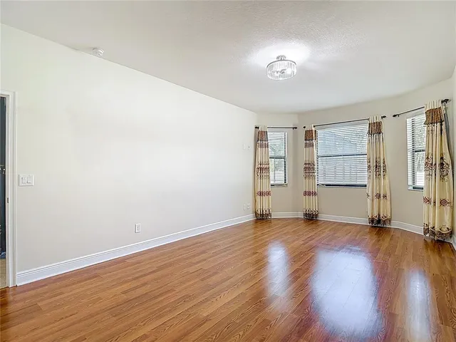 a white bath tub sitting next to a white toilet and sink