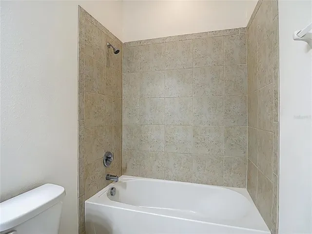 a view of yard with large trees