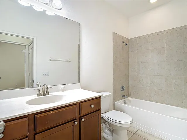 an aerial view of residential houses with outdoor space and street view