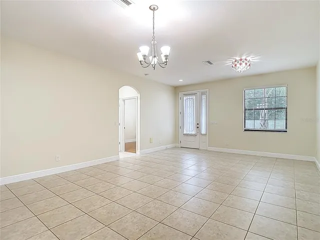 a kitchen with kitchen island granite countertop a sink a counter top space appliances and cabinets