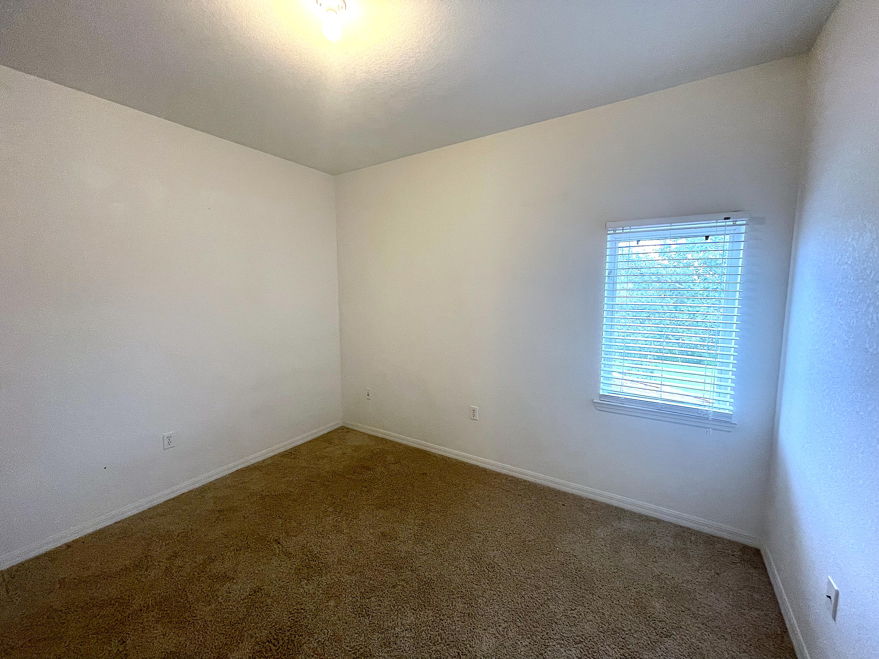 1791 Lakefront Boulevard, Unit 1 Fort Pierce, FL 34982 - Photo 13 of 14 an empty room with a window